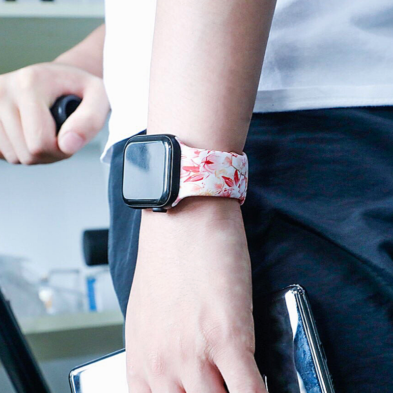 Closeup of Model’s Wrist, Wearing Azalea Flower Style Designer Silicone Sport Band and Apple Watch.