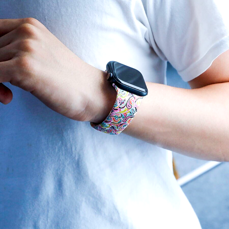 Closeup of Model’s Wrist, Wearing Paisley Style Designer Silicone Sport Band and Apple Watch.