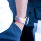 Closeup of Model's Wrist, Wearing Splatter Style Designer Silicone Sport Band and Apple Watch.