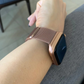Closeup of Model's Wrist, Wearing a Rose Gold Milanese Sport Loop Band and Apple Watch.
