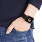 Closeup of Model's Wrist, Wearing a Black Milanese Sport Loop Band and Apple Watch.