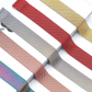 Group of Milanese Apple Watch Loop Bands in Various Colors, Laying Flat on Display.