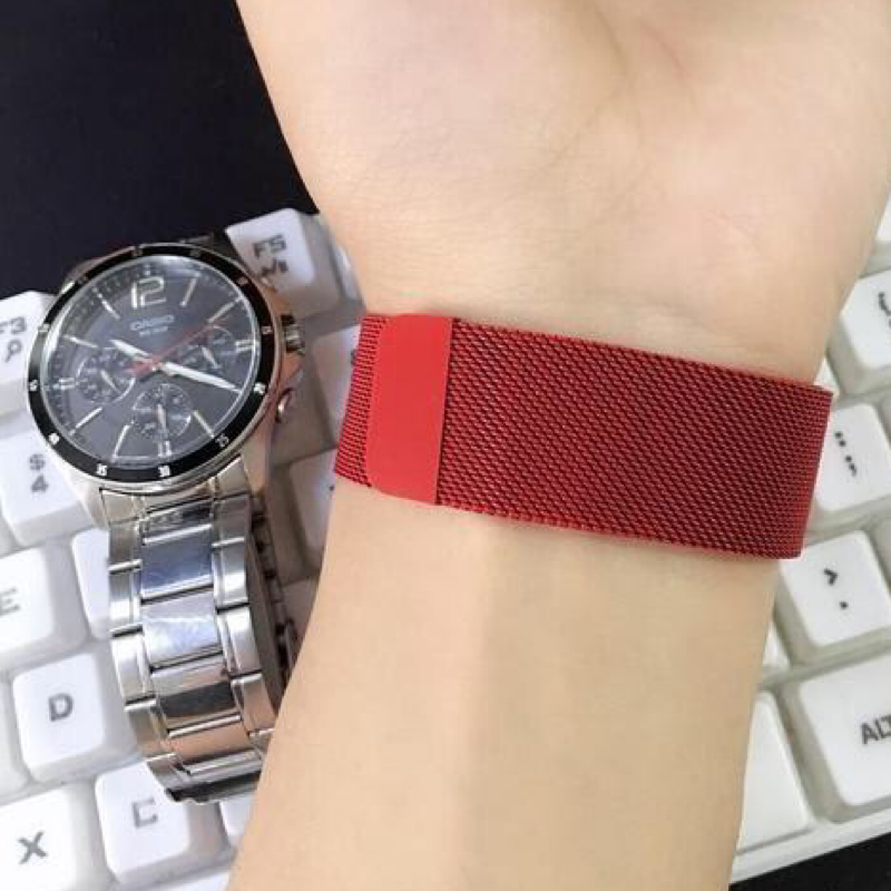 Closeup of Model's Wrist, Wearing a Red Milanese Sport Loop Band and Apple Watch.