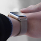 Closeup of Model's Wrist, Wearing a Vintage Gold Milanese Sport Loop Band and Apple Watch.