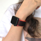 Closeup of Model's Wrist, Wearing a Black and Red Nylon Sport Loop with Apple Watch.