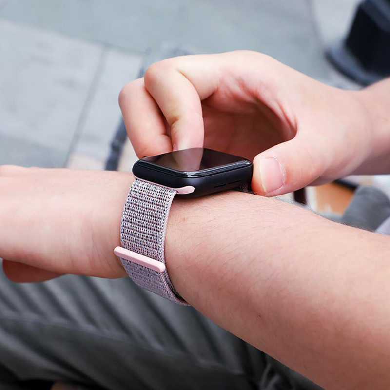 Closeup of Model's Wrist, Wearing a Pink Pearl Nylon Sport Loop with Apple Watch.