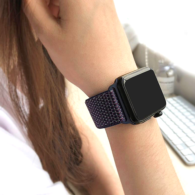 Closeup of Model's Wrist, Wearing an Indigo Nylon Sport Loop with Apple Watch.