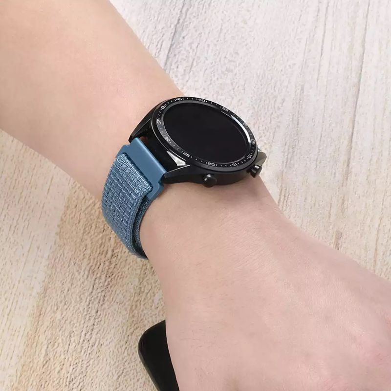 Closeup of Model’s Wrist, Wearing an Ocean Blue Nylon Sport Universal Loop Band with Huawei Watch.