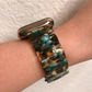 Closeup of Model's Wrist, Wearing an Emerald Bronze Band with Apple Watch.