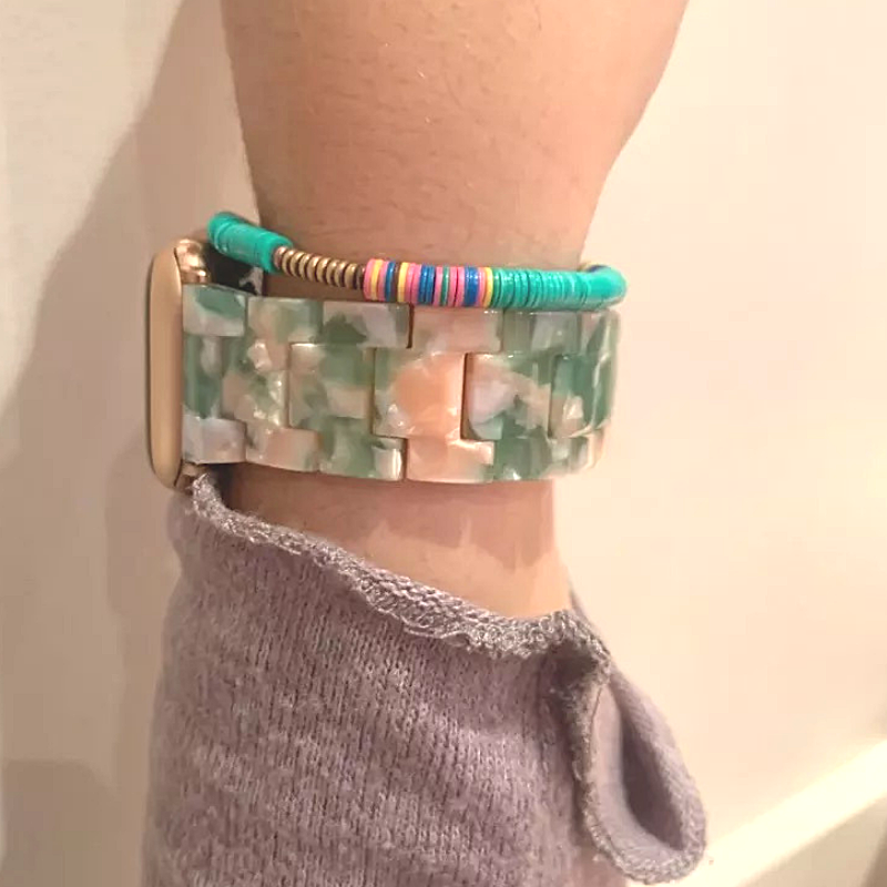 Another Closeup of Model's Wrist, Wearing a Pink and Sage Green Resin Band with Apple Watch.
