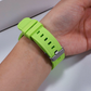 Closeup of Model's Wrist, Wearing a Smartwatch with a Lime Green Rugged Silicone Sport Universal Watchband.