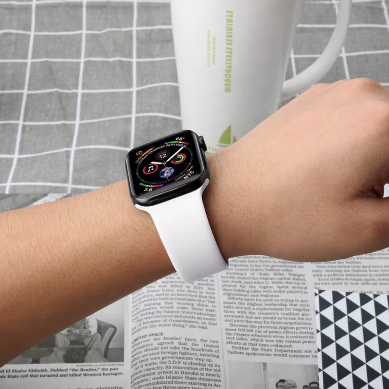 Closeup of Model’s Wrist, Wearing an Alpine White Silicone Sport Strap and Apple Watch.