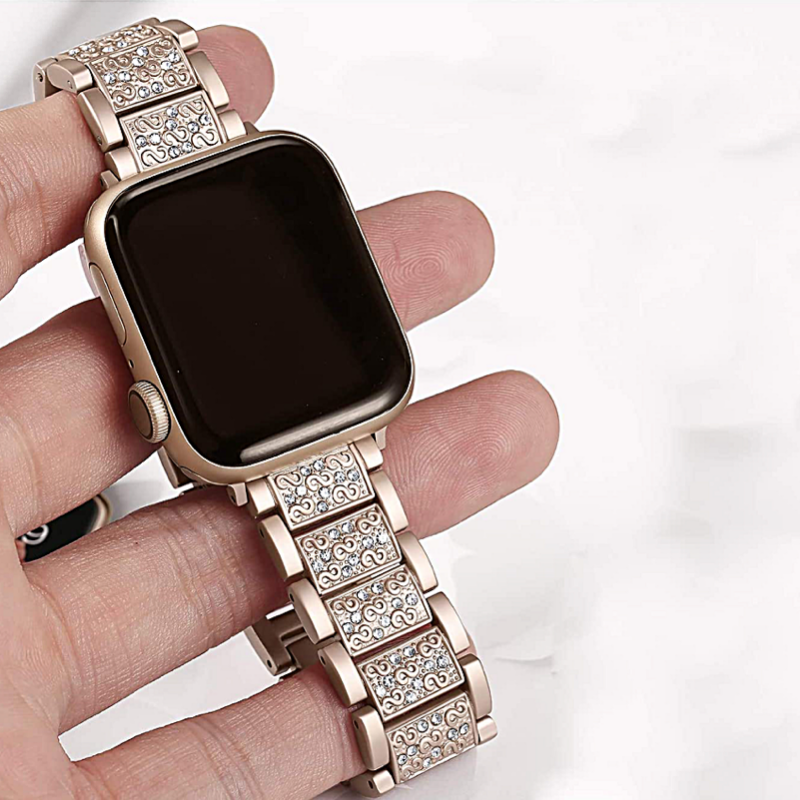 Closeup View of a Model's Hand, Holding an Apple Watch with a Champagne Gold Vintage Style Diamond Link Bracelet Band.