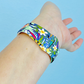 Another Closeup of Model’s Wrist, Wearing a Colorful Tropical Flamingo Pineapple Pattern Silicone Sport Apple Watch Band.