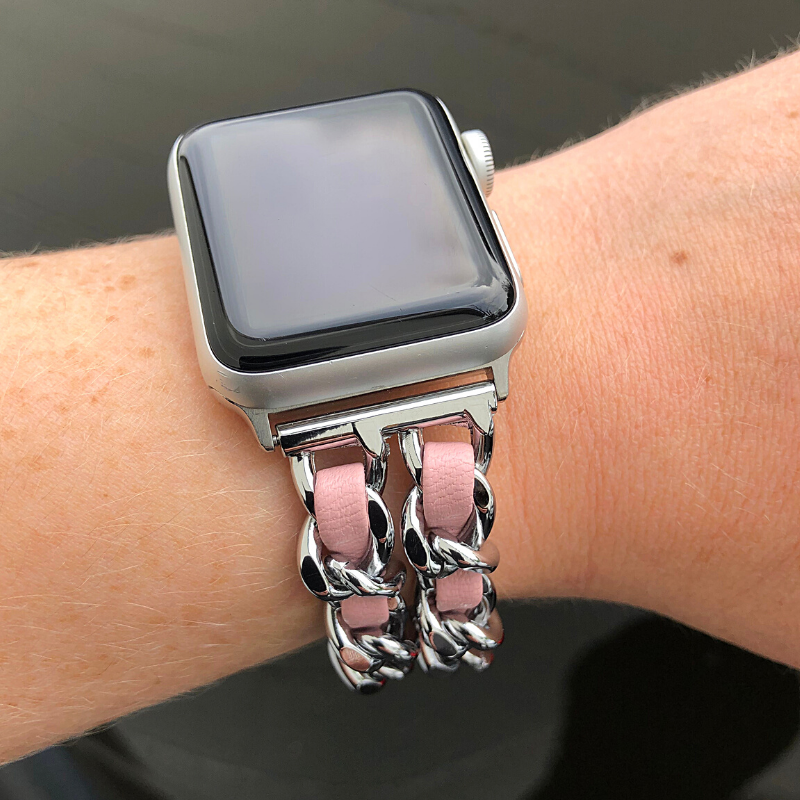 Closeup of Model's Wrist, Wearing a Silver and Light Pink Leather Chain Bracelet Band and Silver Apple Watch.