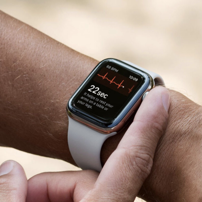 Closeup of Model’s Wrist, Wearing a Fog Gray Silicone Sport Strap and Apple Watch.